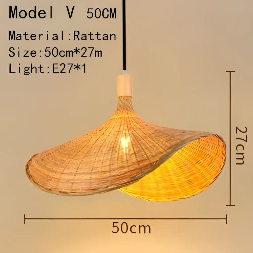 Handwoven black woven pendant light in rattan with a warm golden hue and textured finish for dining room lighting