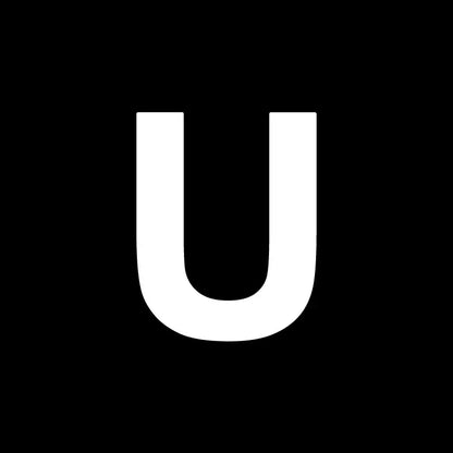 White uppercase letter u on black background for decorbites heart cake mold used in kitchen baking and decorating