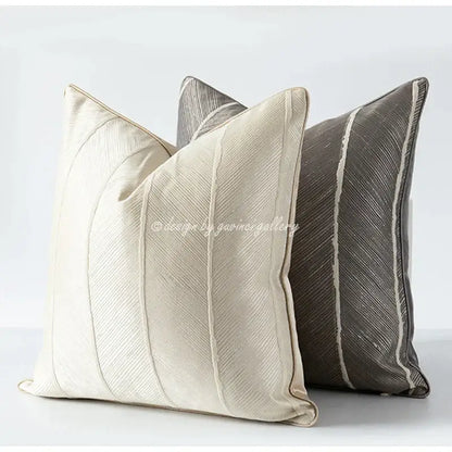 Cream-colored herringbone jacquard cushion cover with subtle diagonal ribbed texture and matching piping for living room decor