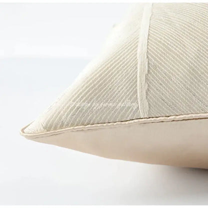 Cream-colored herringbone jacquard cushion with ribbed texture and vertical stitching for beige and white living room decor