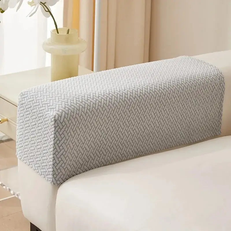 Light gray knit fleece sofa armrest cover with woven herringbone pattern for living room set protection