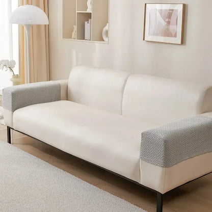Cream-colored sofa with textured gray herringbone weave fleece armrest covers and sleek black metal legs for living room protection