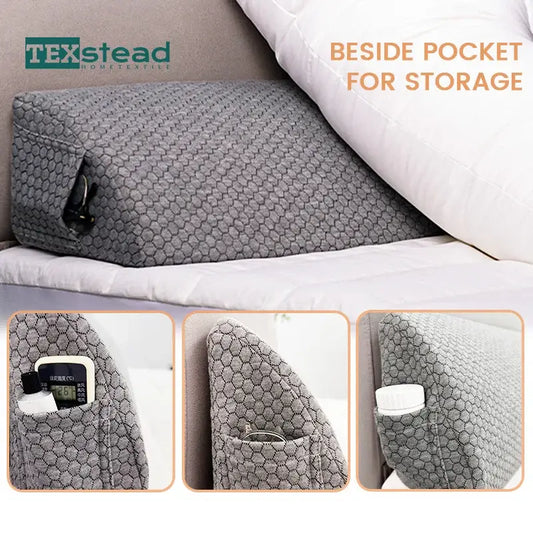 Gray hexagonal-patterned pillow wedge with side storage pocket designed as a bed headboard pillow wedge