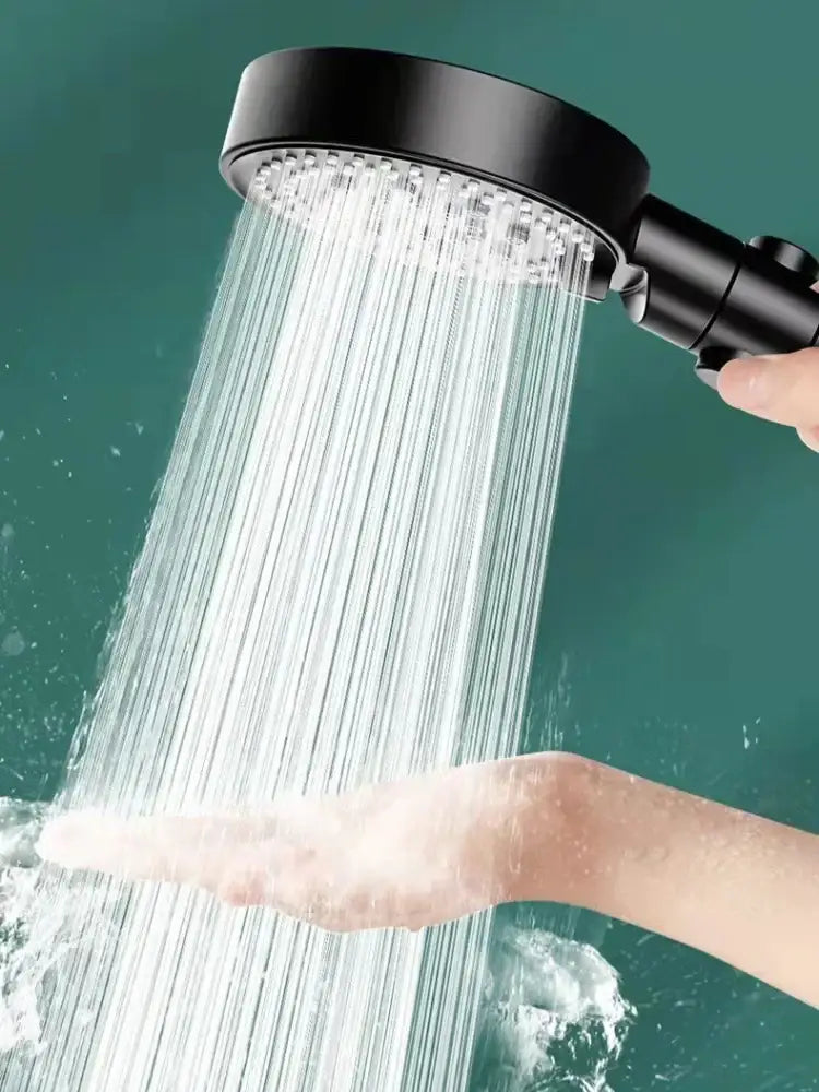 High pressure black decorbites round shower head with multiple nozzles emitting steady water stream for bathroom use