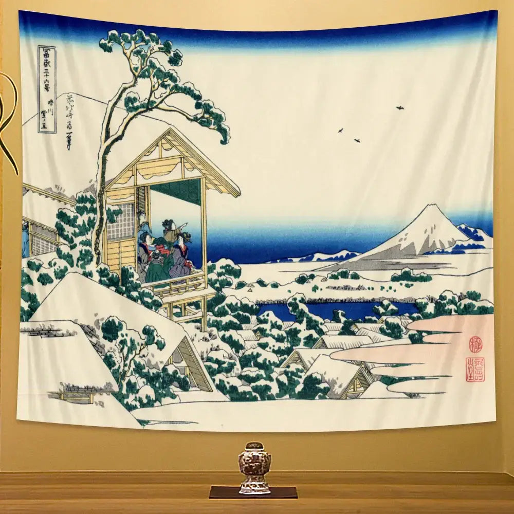 A hanging beach scenery tapestry featuring a traditional japanese winter landscape with mount fuji and snow-covered houses