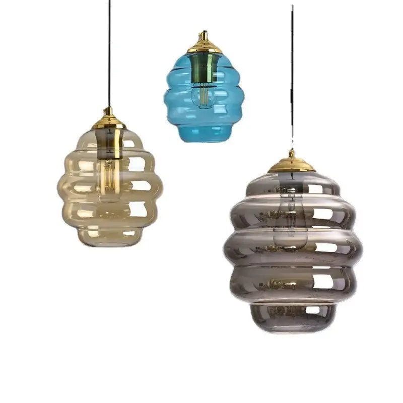 Honeycomb amber blue and gray glass pendant light with gold-toned metal fixtures for kitchen dining decorbites colorful glass