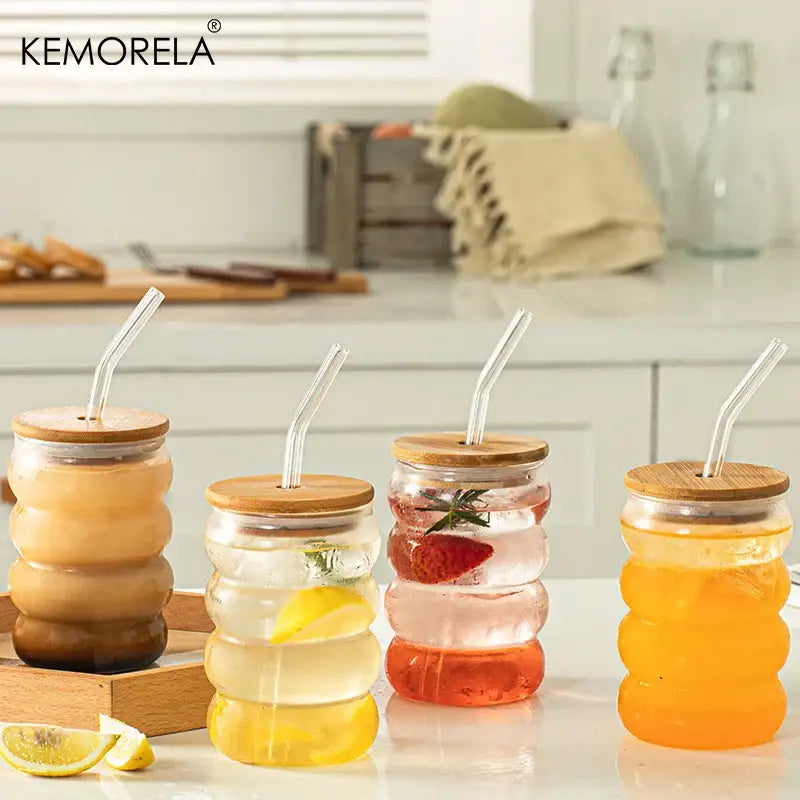 Clear glass honeycomb creative glass cup set with bamboo lids and curved glass straws filled with colorful beverages
