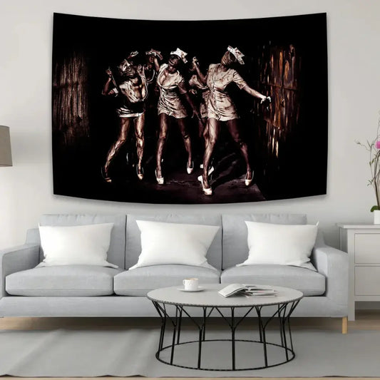 Black and sepia horror movie character tapestry featuring three dancers in metallic outfits above a gray sofa decorbites