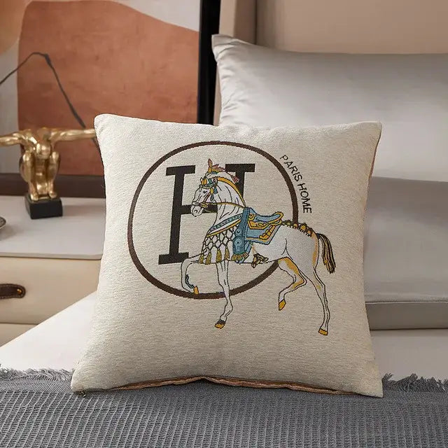 Beige pillow cover with horse embroidered jacquard design featuring white horse and paris home emblem decorbites horse embroidered
