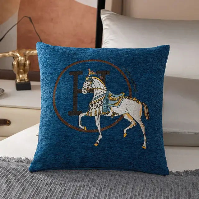 Blue embroidered pillow cover featuring a white horse with gold and blue detailing on a brown emblem for decorbites horse embroidered jacquard decor