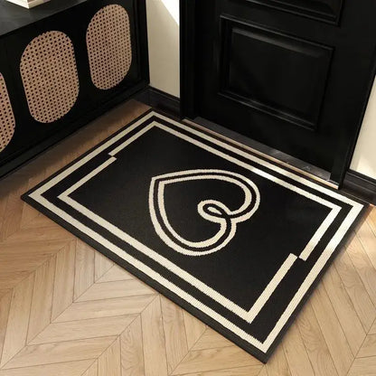 Black and white woven houndstooth black ivory entrance mat with stylized heart design and geometric border for living room floor decor