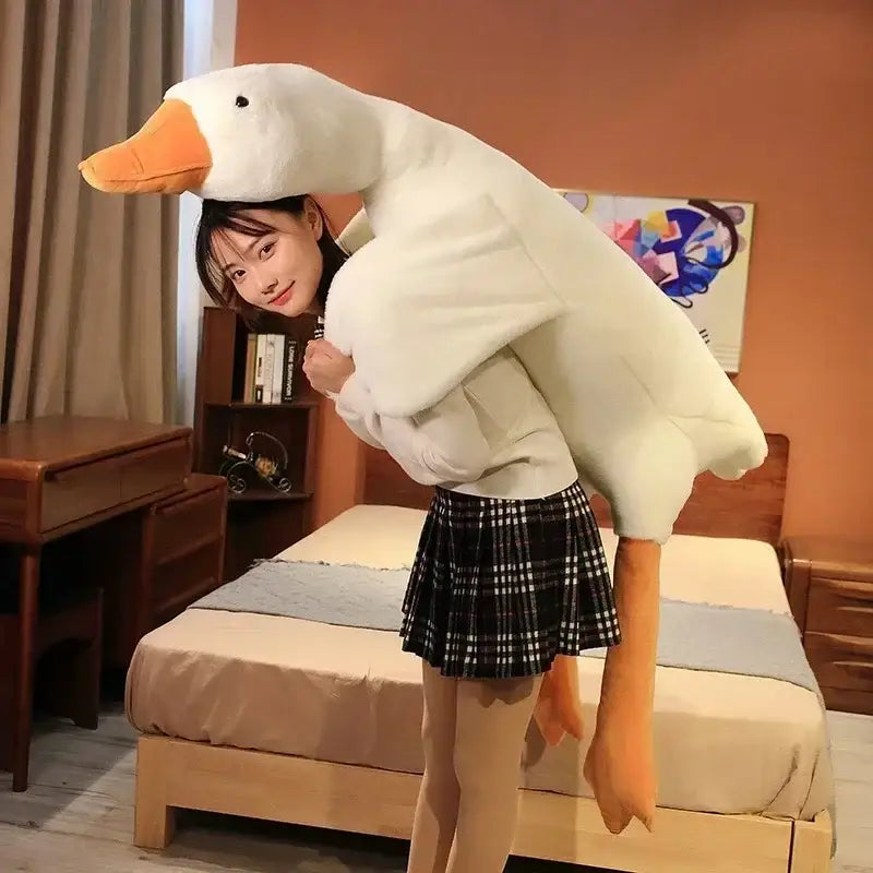 A plush white huge goose body pillow made of soft fabric with orange beak and feet for bedroom decorbites huge goose decor