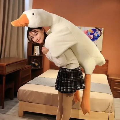 A plush white huge goose body pillow made of soft fabric with orange beak and feet for bedroom decorbites huge goose decor