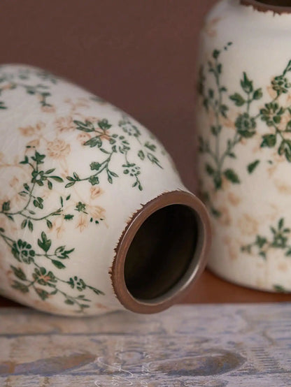 White ceramic crackle vase with distressed brown rim and green floral patterns for home decor and flower display