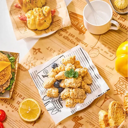Golden crispy fried chicken served on white grease-resistant baking paper with black line art illustrations