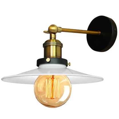 Industrial adjustable wall light with brass arm, black mounting plate, and white ceramic shade for kitchen decorbites industrial adjustable