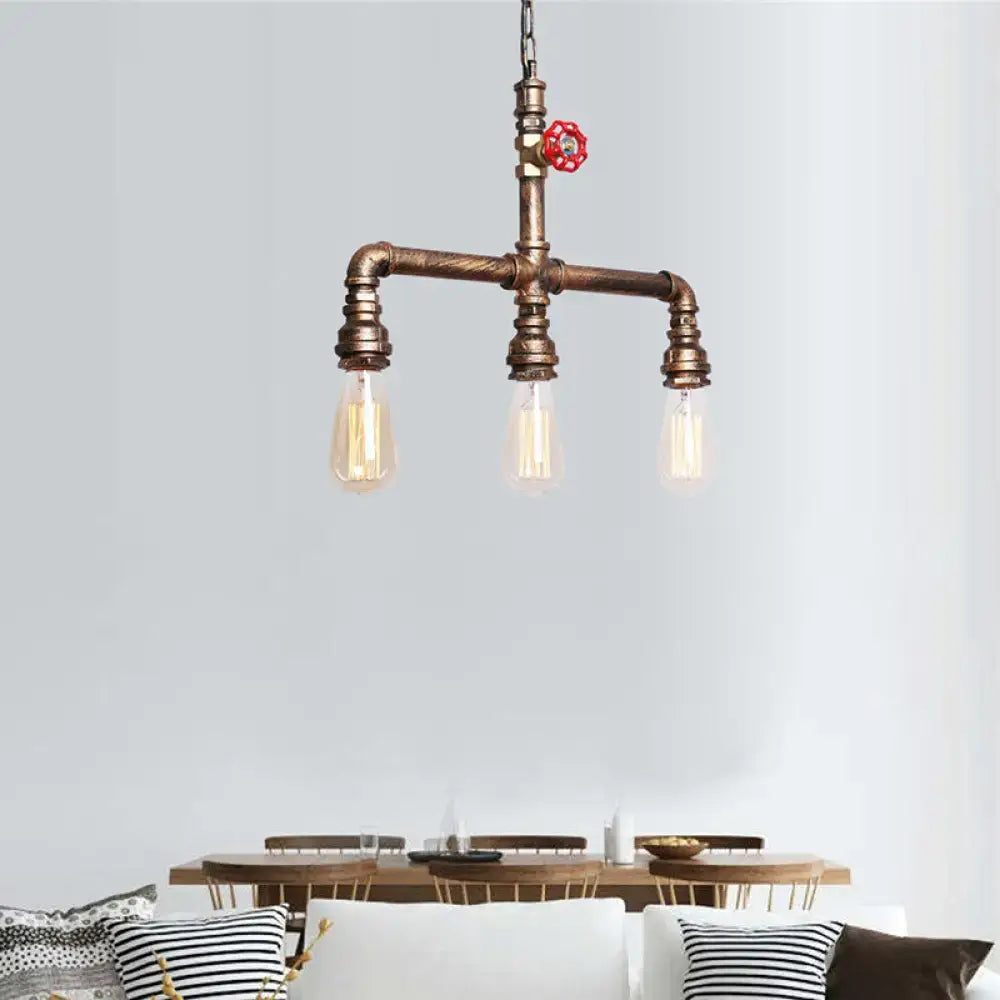 Decorbites vintage antique brass pendant light featuring three exposed filament bulbs and red valve wheel accent