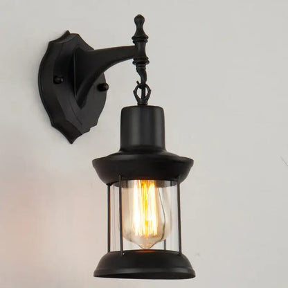 Black wrought iron industrial glass wall lamp with glass lantern design and exposed filament bulb for decorbites industrial glass decor