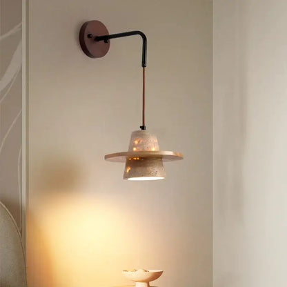 A modern beige concrete wall lamp with a black metal arm featuring decorbites led wall pull chain design