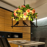 Decorbites iron industrial birdcage island pendant in black finish with artificial roses and decorative bird figures