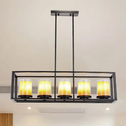 Black metal rectangular light fixture with five warm yellow glass candle bulbs for amber cylinder island lighting