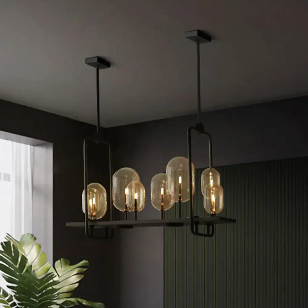 DecorBites™ industrial pendant light with six amber glass bulbs, black metal frames, and adjustable chain cord length