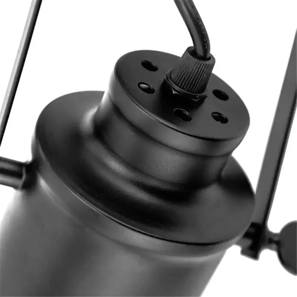 Industrial vintage adjustable ceiling lamp with black matte metal cylindrical body and amber dining room spotlight design