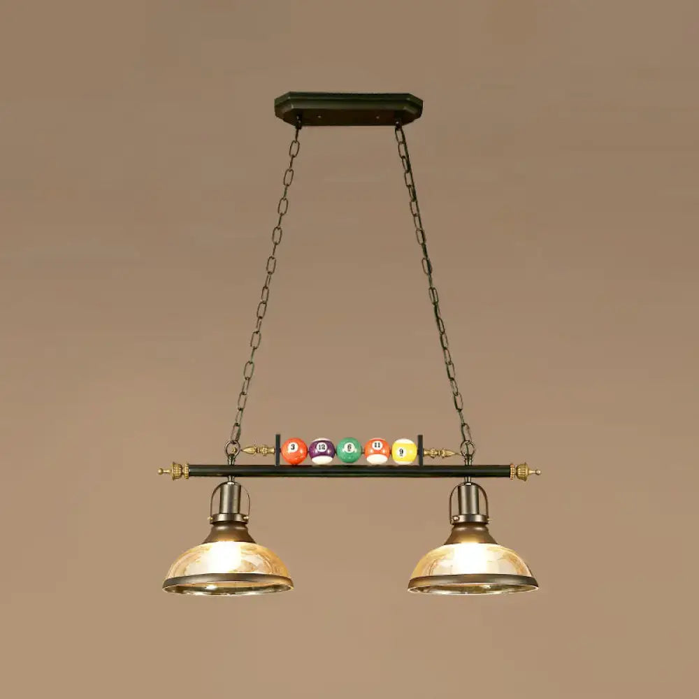 Decorbites™ industrial style hanging light with black metal finish, brass dome shades, and colorful billiard ball deco