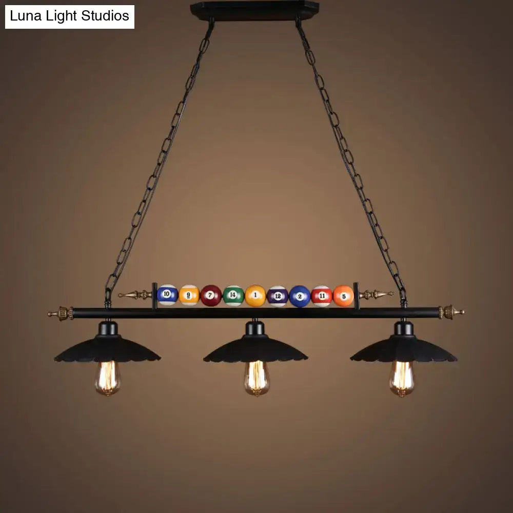 Decorbites industrial style hanging light with black metal finish, three exposed bulbs, and colorful billiard ball deco
