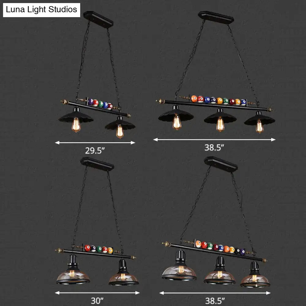 Black metal industrial style hanging pool table light with vintage bulbs and colorful billiard ball deco accents