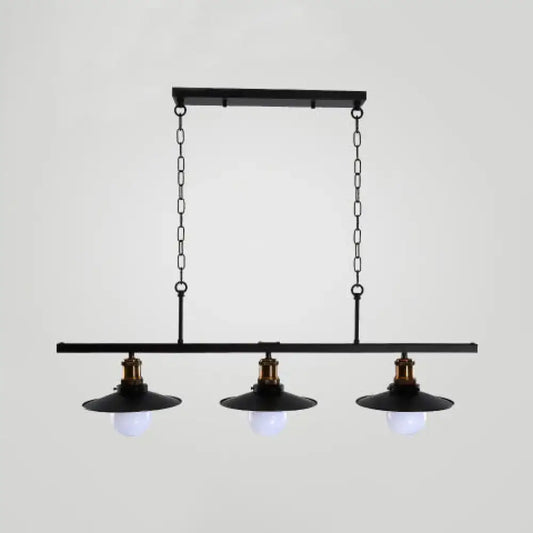 Black industrial-style metal kitchen ceiling light with three exposed bulbs and brass accents for flat shade island lighting