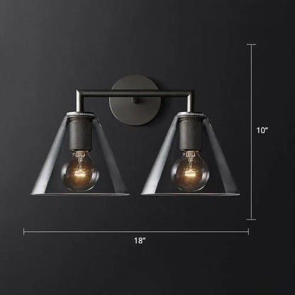 Industrial black and brass wall lamp with clear glass conical shades featuring two exposed filament bulbs fixture type