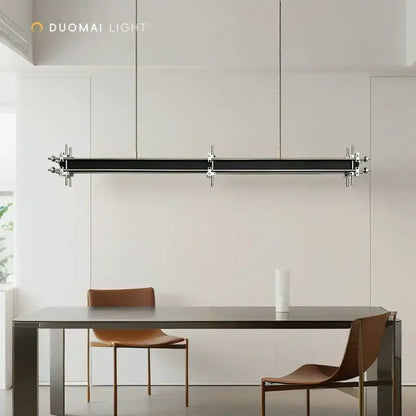 Modern black linear pendant chandelier with chrome hardware and chain suspension for dining room decorbites industrial style