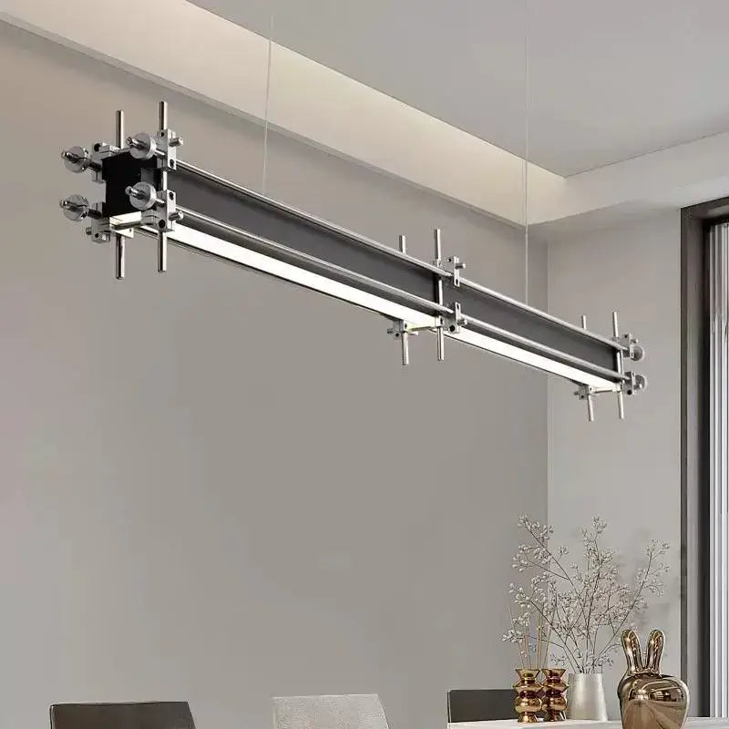 Modern chrome-finished industrial style pendant chandelier with black accents and adjustable mounting for dining room decorbites industrial style