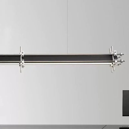 A sleek industrial style pendant chandelier with a black bar and polished chrome fixtures for dining room decorbites
