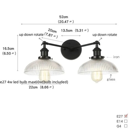Industrial black iron wall light fixture with two ribbed glass shades and adjustable arms for bedroom use