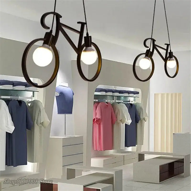 Industrial black bicycle pendant light with circular frame and exposed bulb fixture for living room decorbites industrial bicycle decor