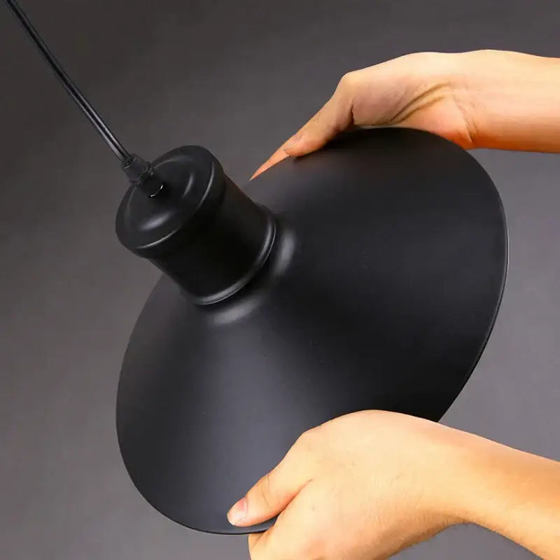 Industrial black bird cage pendant light with black matte finish and cylindrical stem for dining room decorbites bird cage
