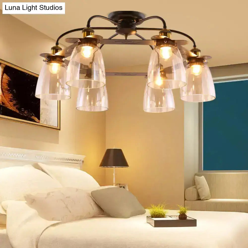 A vintage-style decorbites™ ceiling lamp with dark bronze frame and five cognac glass bell shades for living room