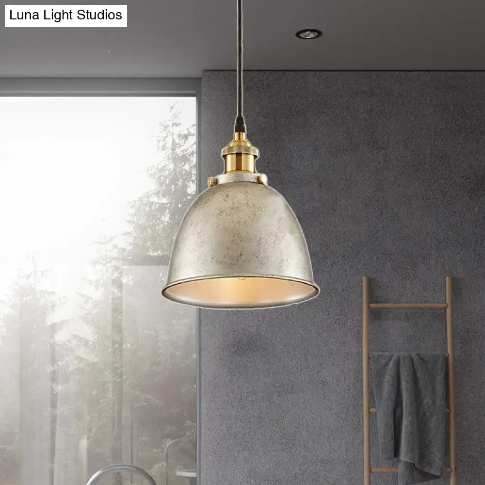 Industrial-style pendant lamp with distressed metallic finish and brass accents in black rust antique style dome design