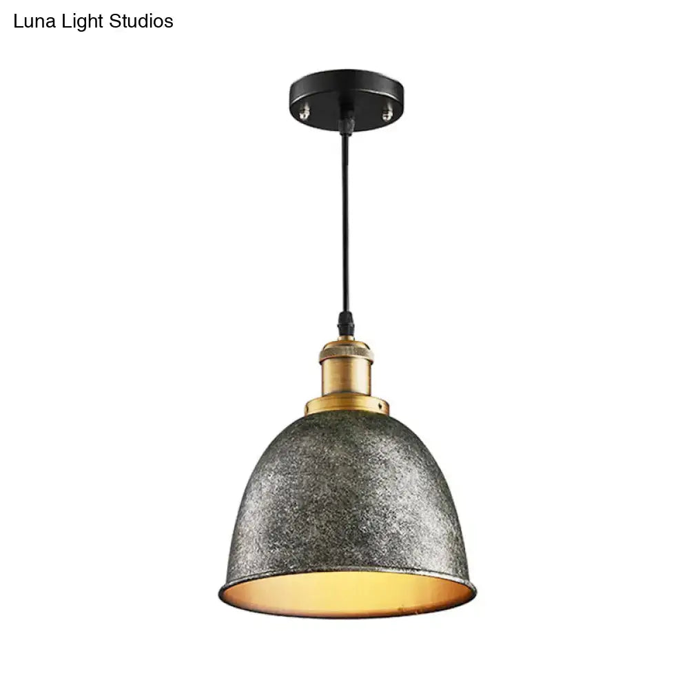 Industrial-style pendant lamp with distressed metallic gray antique style dome and brass accents by decorbites