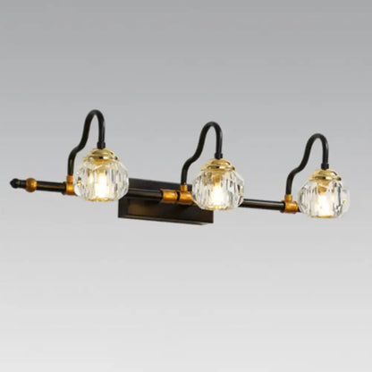 Industrial black and brass hexagon vanity wall lamp with dark bronze finish and clear crystal prisms globes