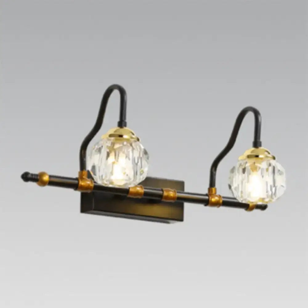 Industrial black and brass hexagon vanity wall lamp with two crystal prism globe shades and metal accents