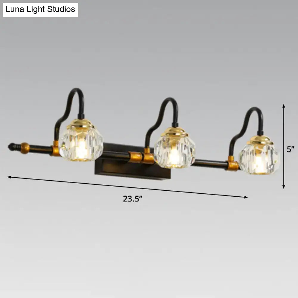 Three-light industrial black and brass hexagon vanity wall lamp with crystal prisms and faceted glass shades