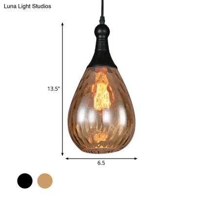 A teardrop amber glass ceiling light with black metal fixture from DecorBites daisy industrial black brass series