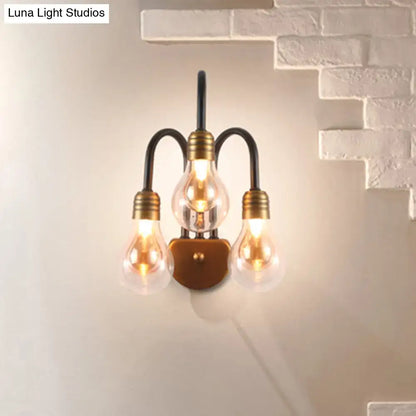 Industrial black and brass wall lamp with three exposed filament bulbs and curved metal arms 220v-240v light type