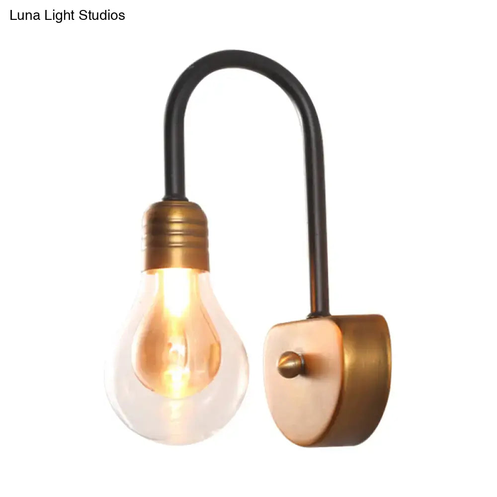Industrial black and brass wall lamp with curved arm and exposed filament bulb suitable for bedroom light fixture width