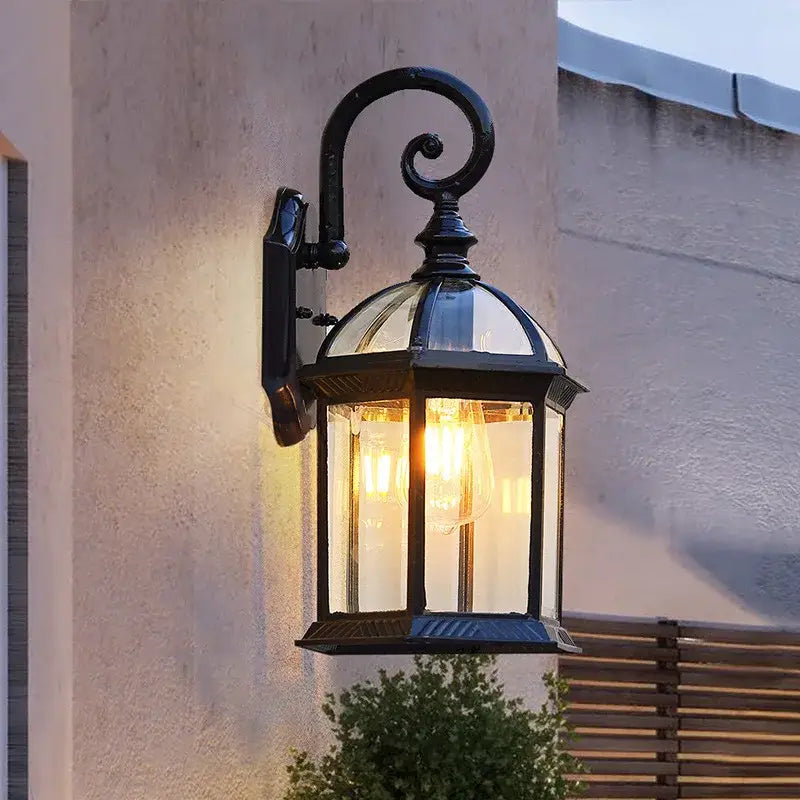 Industrial black bronze wall lamp outdoor lantern with black wrought iron curved arm and clear glass panels