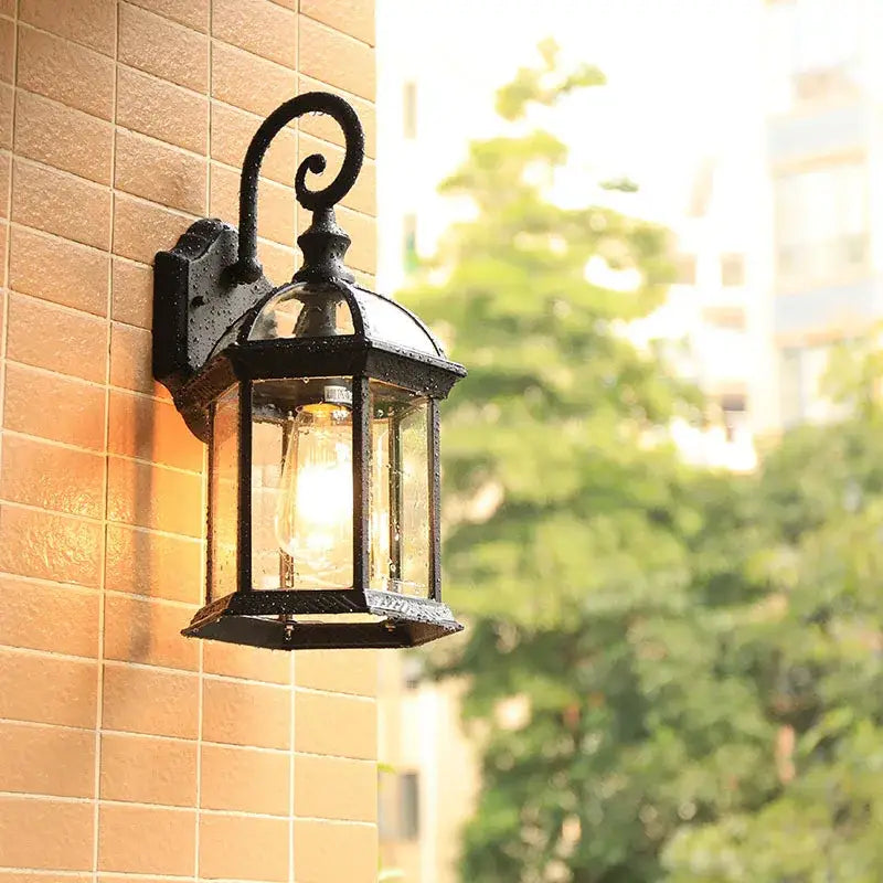 Industrial black bronze wall lamp outdoor lantern featuring black wrought iron and clear glass panels for decorbites black bronze wall decor