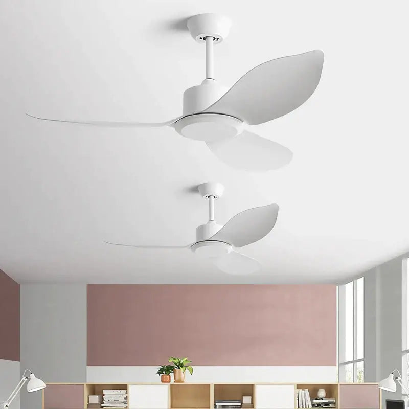 Modern white ceiling fan with sleek aerodynamic blades and remote control for industrial black and brown bedroom use